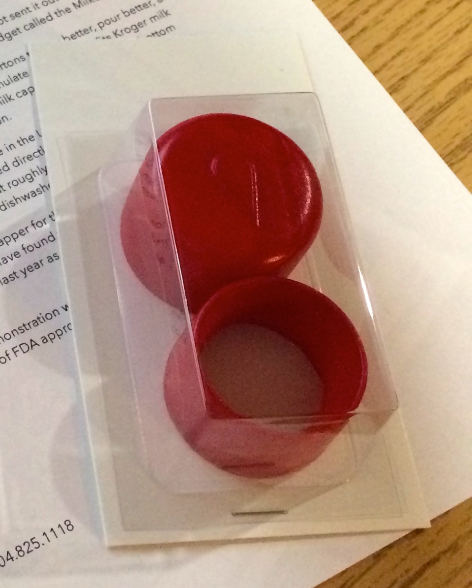 The MilkCapper 3D-printed prototype — red 2-piece cap in blister pack
